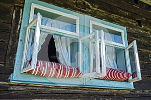 Pillows in the window, open-air museum in Stara Lubovna, Slovakia