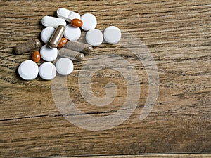 Pills background on wood