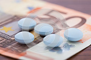 Pills on banknote