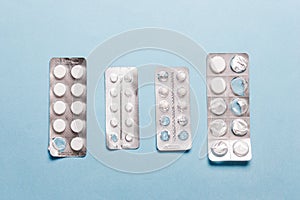 Pills blister pack on a blue background