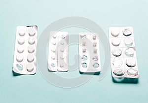 Pills blister pack on a blue background