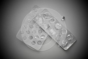 Pills blister pack on a gray background