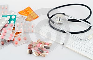 Pills, blisters and a stethoscope photo