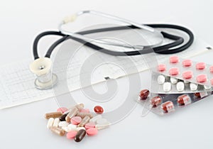 Pills, blisters and a stethoscope photo