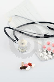 Pills, blisters and a stethoscope photo