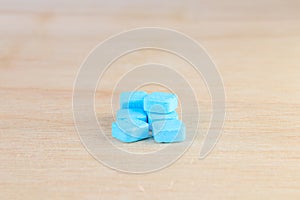 pills blue On wooden floor with copy space add text