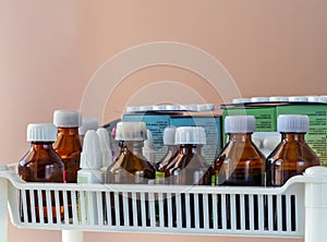 Pills, bottles with tinctures and liquid medicines on a shelf in a pharmacy, hospital, laboratory, clinic, home medicine cabinet.