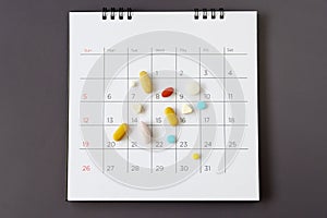 Pills on a calendar background. concept Healthcare
