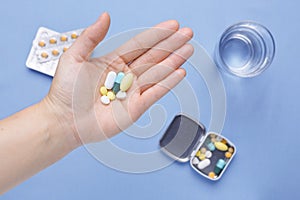 Pills and capsule on hand