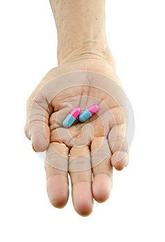Pills capsule on hand outstretched