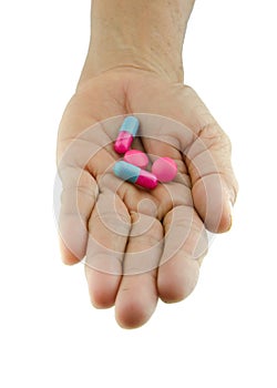 Pills capsule on hand outstretched