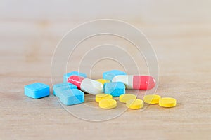pills and capsule On wooden floor with copy space