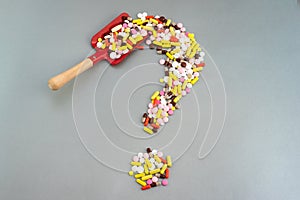 Pills Or Capsules As A Question Mark On White Isolated Background. Healthycare concept