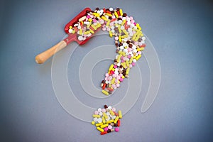 Pills Or Capsules As A Question Mark On White Isolated Background. Healthycare concept