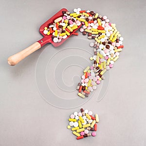 Pills Or Capsules As A Question Mark On White Isolated Background. Healthycare concept