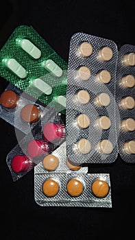 Pills and capsules of different shapes and colors