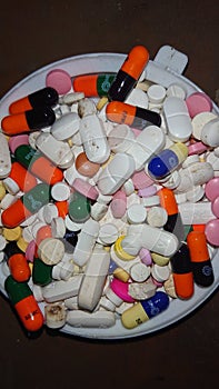 Pills and capsules of different shapes and colors