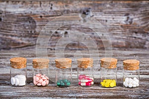 Pills and capsules in glass containers