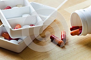 Pills, capsules and tablets sorted in pillbox