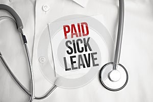 Pills, covid test and a medical phonendoscope with the inscription paid sick leave on a blue background. FMLA Family Medical Leave