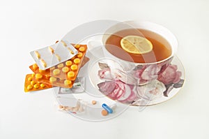 Pills and a cup of lemon tea
