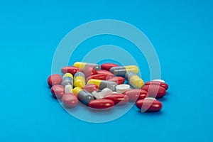 Pills, drugs on colorful background. Healthcare concept. Shallow depth of field, soft focus