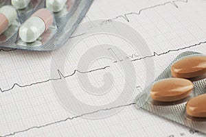 Pills on EKG heart sheet