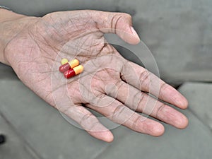 Pills on elder hand