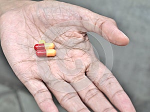 Pills on elder hand