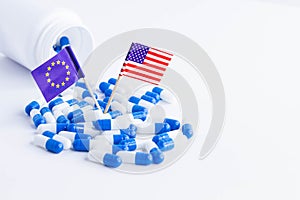 Pills and EU and USA flag. Import of tablets to the USA