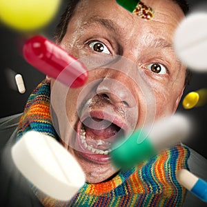 Pills falling into open mouth