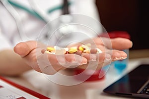 Pills in female doctor hands