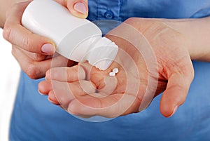 Pills in a female hands