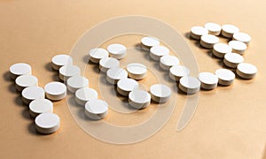 Pills forming the word â€œHELPâ€
