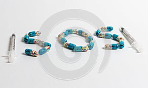 Pills forming the word â€œSOSâ€