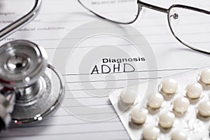 Pills;Glasses And Stethoscope With Text Diagnosis ADHD photo