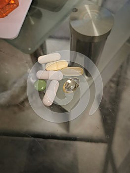 pills laying on a glas table