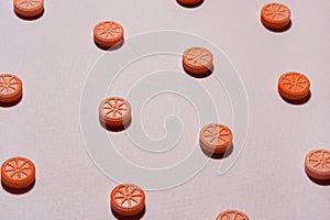 Pills like an orange on a beige background. Vitamin C. Health concept