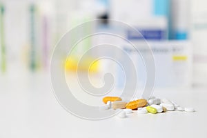 Pills and medicine capsule on table, drugs and tablets boxes