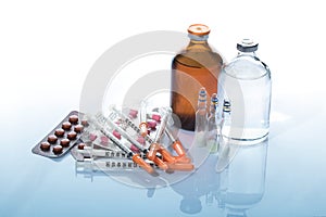 Pills and medicine Vials with syringe.
