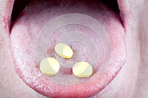 Pills in mouth