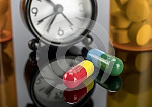 Pills next to a clock, conceptual image