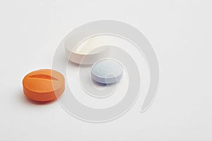 Pills over a white background. Medicament treatment. Health care