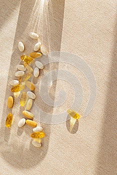 pills on pastel background. Health care and morning routine concept. Supplements and vitamins