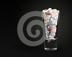 Pills in shot glass