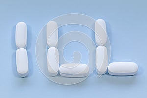 Pills spelling out the word `Ill`
