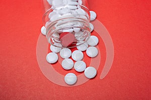 Pills spilling out from glass  container.  Medicine and healthcare