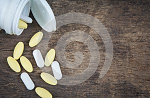 Pills spilling out of pill bottle