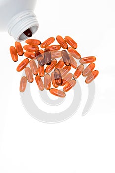 Pills spilling out of pill bottle. Assorted pharmaceutical medicine pills, tablets and capsules on white background. Antiretrovira