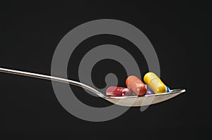 Pills in spoon